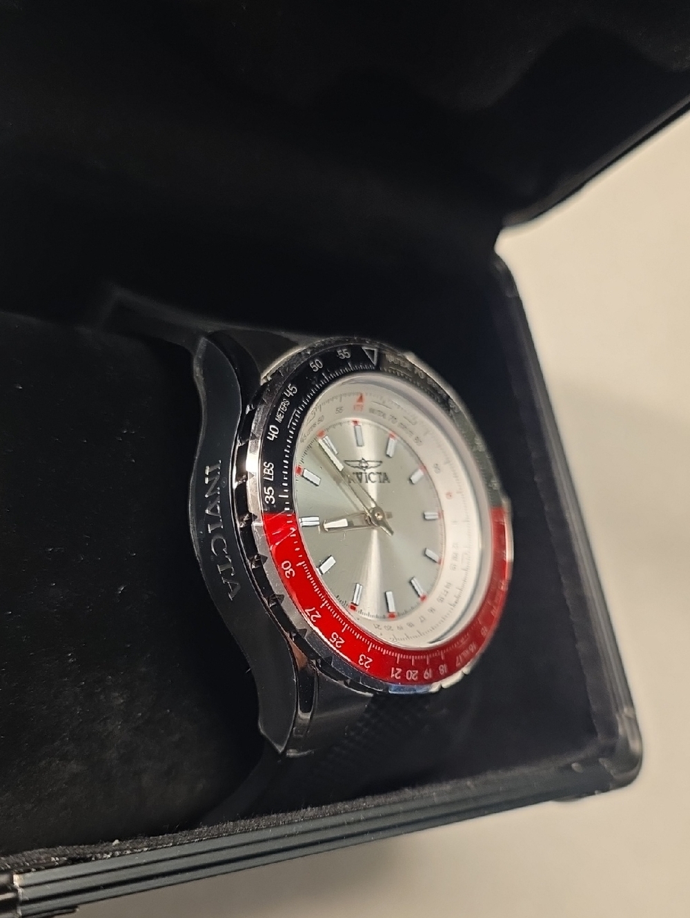 37. Invicta Silver Dial Watch with Red & Black Bezel